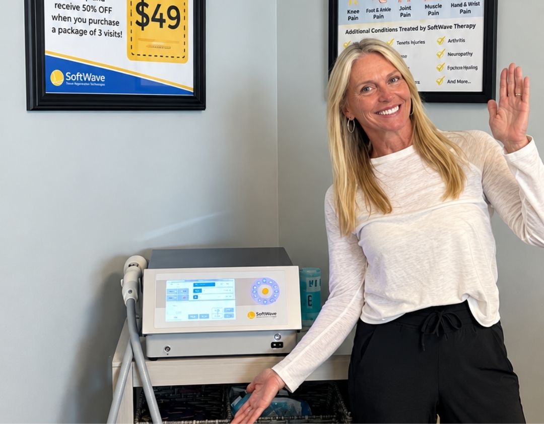 Dr. Kim Raby with the SoftWave OrthoGold 100 device at Dynamic Chiropractic, Fort Lauderdale